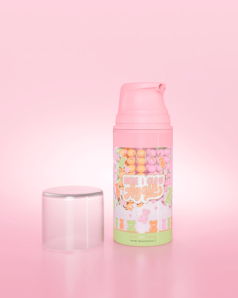 Lila flaska P. Louise Here I Glow Again Candy Bears Recovery Mask på en rosa bakgrund