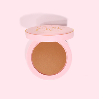 Compact P.Louise baked bronzer powder in a pink case on a light pink background