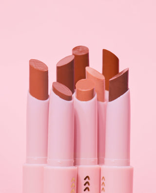 Close-up on a set of P.Louise Glow Guide Glossy Lipstick Balms in a range of colours