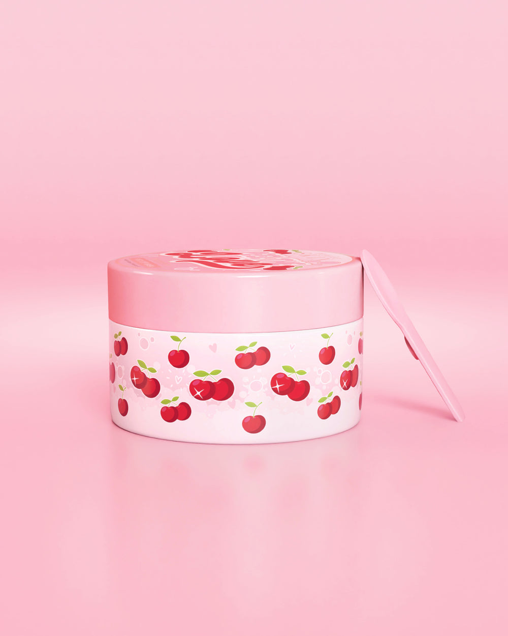 Roze container met kersenontwerp op een roze achtergrond