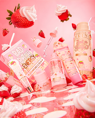 P.Louise What A Treat Strawberries And Cream Skincare Bundle surrounded by strawberries