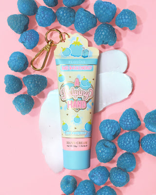P. Louise A Helping Hand Hand Cream with blue raspberries on a pink background