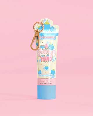 Tube of P. Louise A Helping Hand Hand Cream with a blue raspberry design on a pink background