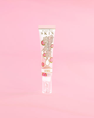 Tube of P. Louise Dose Of Dreams Vitamin C Brightening Eye Cream on a pink background